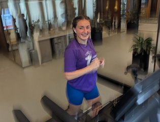 Girl running on a treadmill.